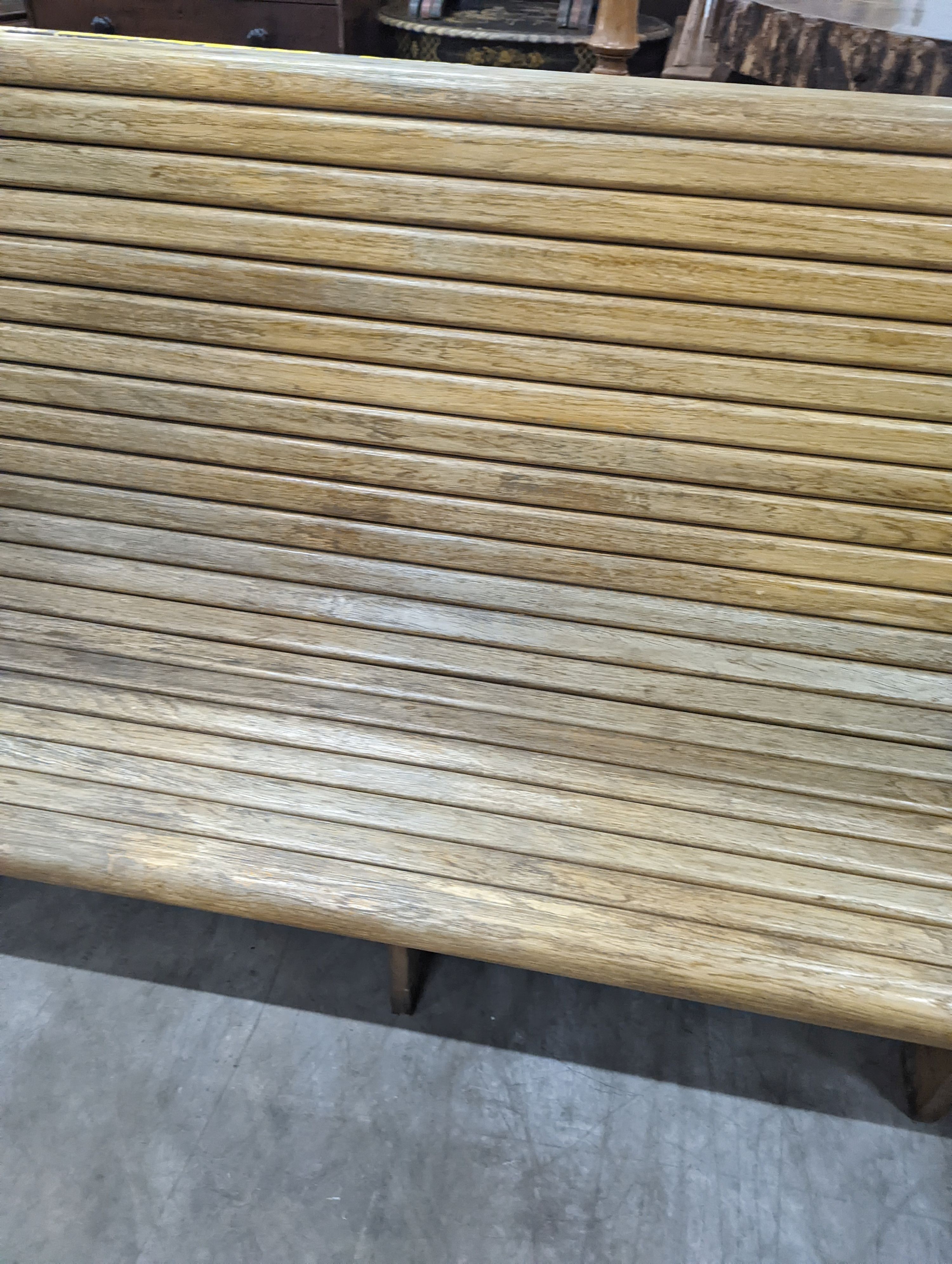 A vintage slatted wood tram bench, length 140cm, depth 60cm, height 98cm